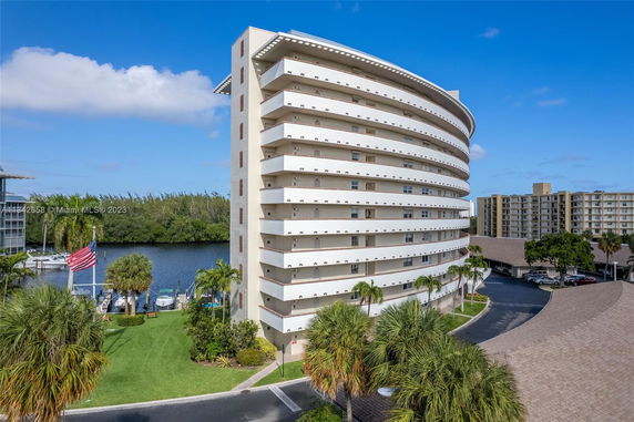 Front view of a multi-story building with curved balconies.