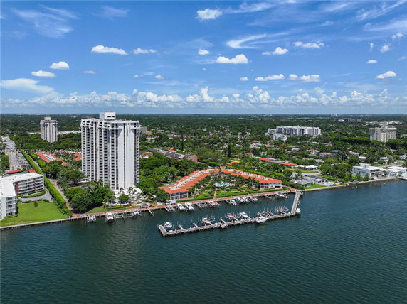 Panoramic view of waterfront buildings and marina.