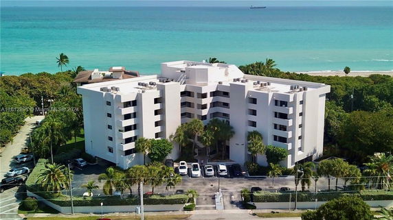 Front view of a multi-story residential building near the beach.