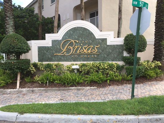 Entrance sign of a residential area with 'Las Brisas at Doral' inscription.