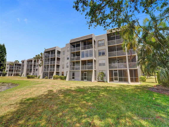 Front view of multi-story apartment buildings with balconies.