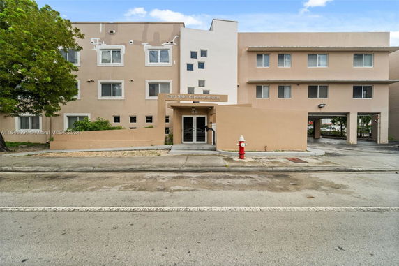 Front view of a multi-story condominium building.