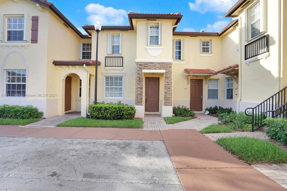 Front view of a two-story townhouse with a central entrance.