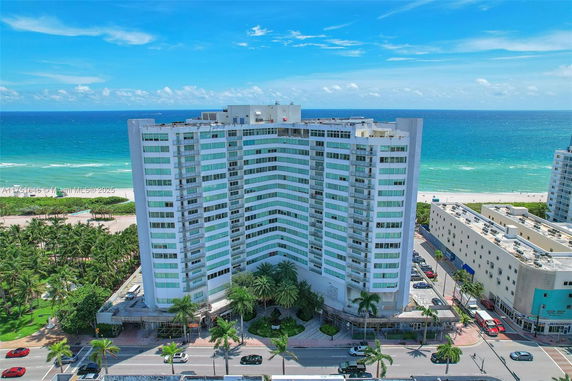 Front view of a multi-story building near the beach.