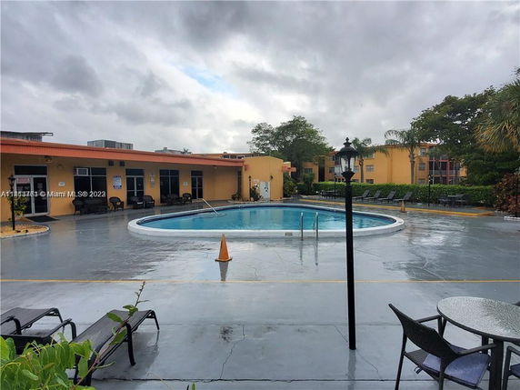 Outdoor swimming pool area in a residential complex.