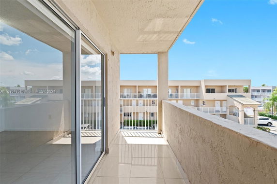 Balcony view overlooking neighboring buildings in a residential area.