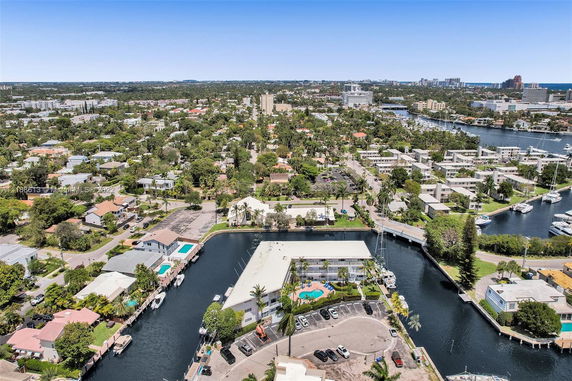 Panoramic view of a residential area with waterways and boats.