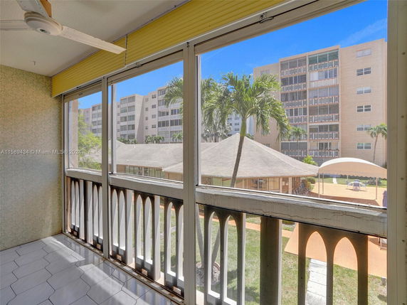 View from a building looking towards other apartment buildings and surrounding areas.