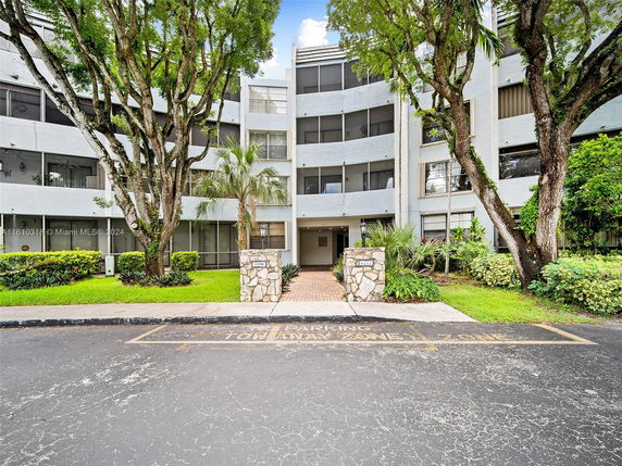 Front view of a multi-story residential building with a modern design.