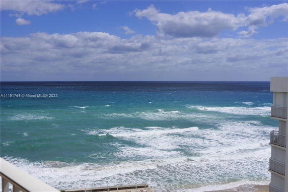 Wide view of the ocean seen from a building.