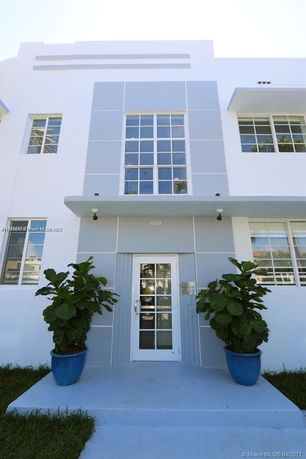 Front view of a building with a modern design and large windows.