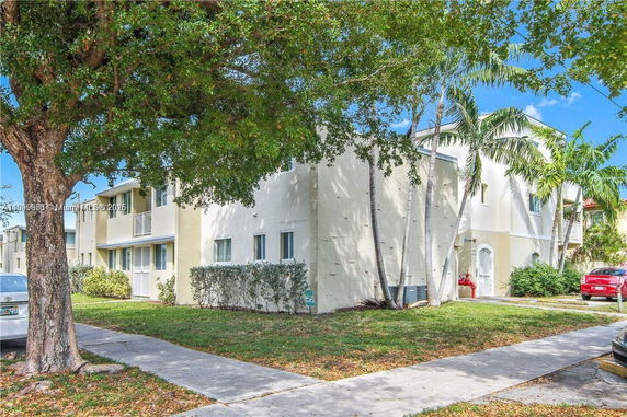 Front view of a two-story residential building with multiple units.