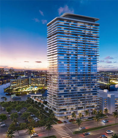 Front view of a modern high-rise building with glass facade.