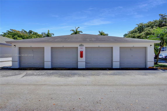 Front view of a building with multiple garage doors.