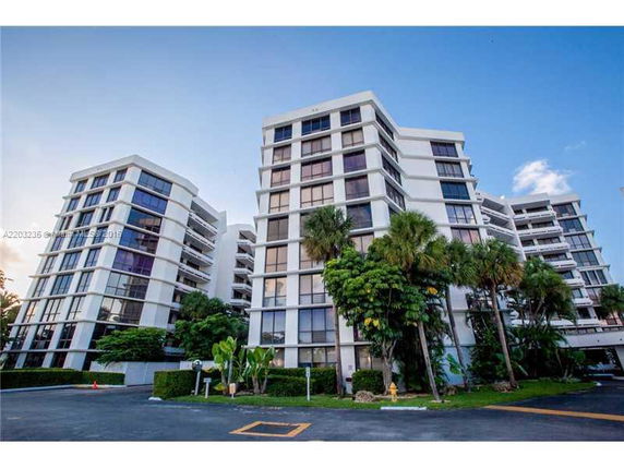 Front view of a modern multi-story apartment building complex.
