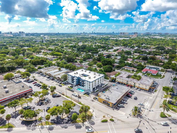 Aerial view of an urban neighborhood with various buildings and roads.
