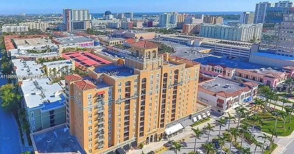 Aerial view of an urban area with a prominent multi-story building.
