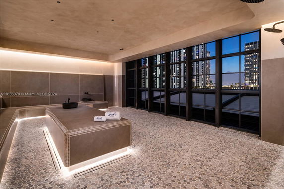 Indoor recreational area with modern design and large windows.