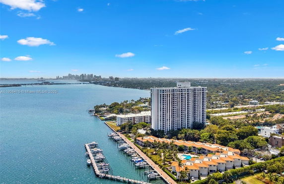 Panoramic view of a waterfront high-rise building and surrounding areas.