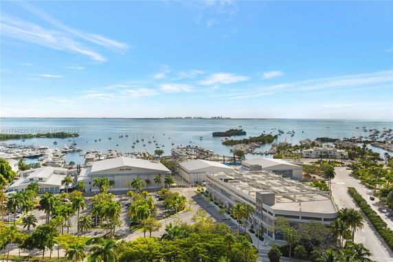 Panoramic view of a marina and surrounding buildings.