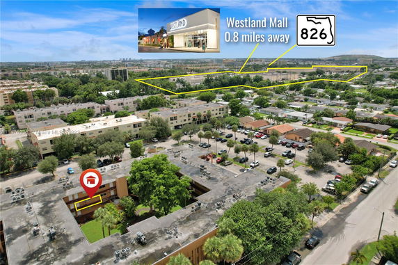 Aerial view of a residential area with multiple apartment buildings and a highlighted location indicating Westland Mall 0.8 miles away.