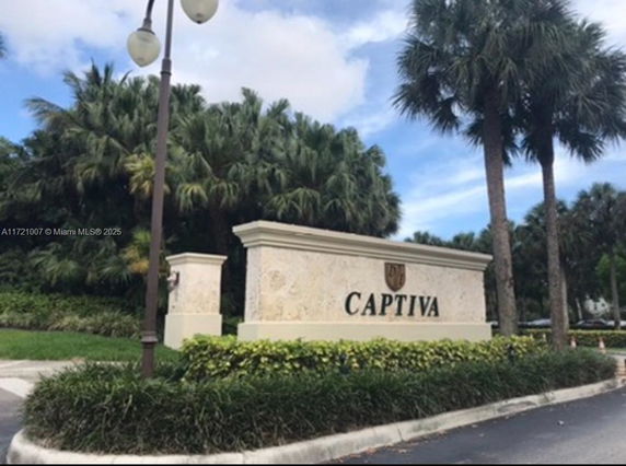 Entrance sign for Captiva surrounded by palm trees.