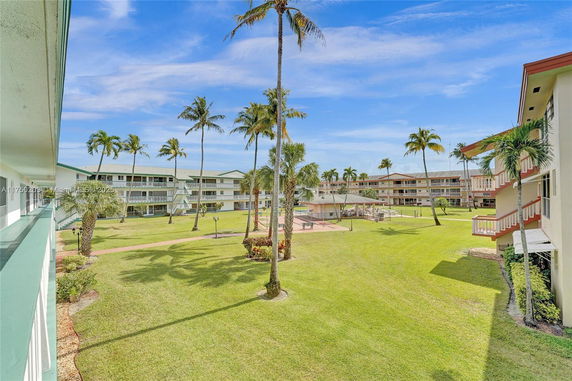 View of surrounding area with multiple residential buildings and landscaped grounds.
