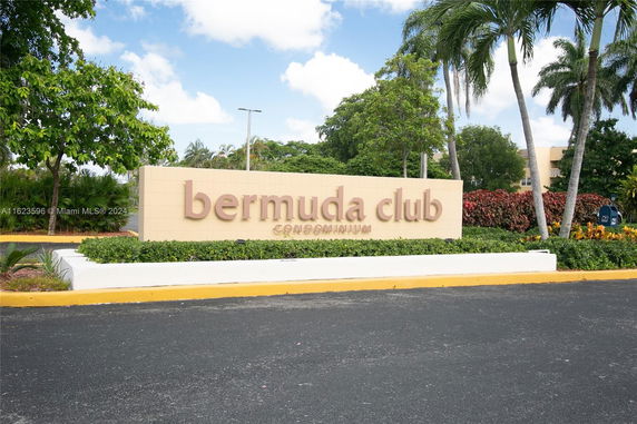 Front view of a sign for Bermuda Club Condominium.