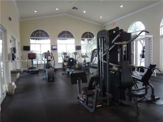 Interior view of a gym area with exercise equipment.