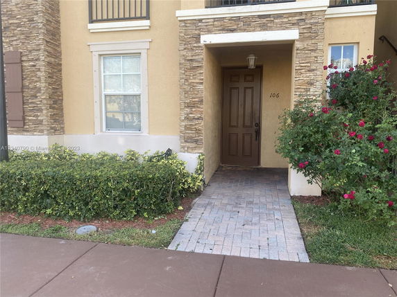 Front view of a house with stone accents around the entrance.