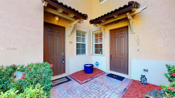 Front view of two adjacent doors in a residential building.