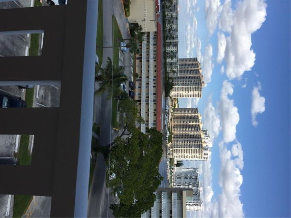 View of multiple high-rise residential buildings from a balcony.