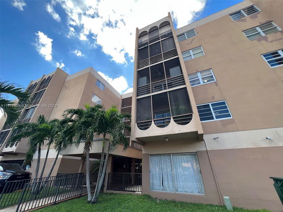 Front view of a multi-story residential building with distinct architectural design.