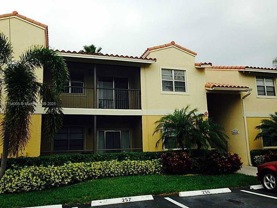 Front view of a two-story residential building with balconies.