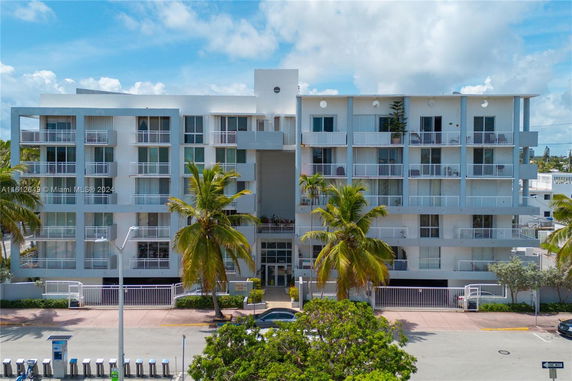 Front view of a multi-story building with balconies.