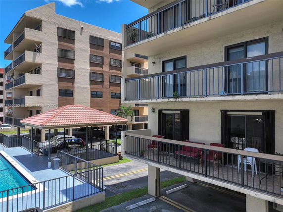 Front view of multi-story apartment buildings with balconies.