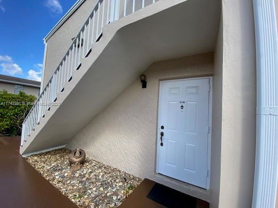 Entrance view with staircase leading to the upper level of a building.