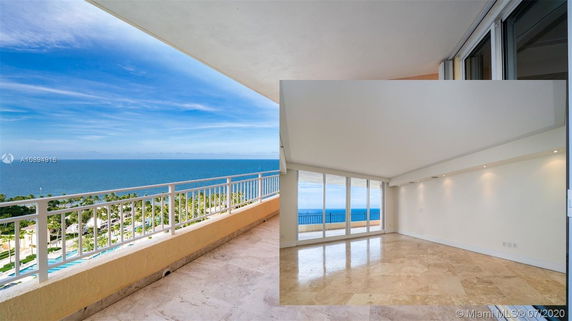 Wide angle view from a balcony showing the ocean and surrounding area.