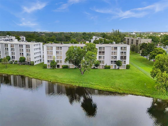 View of residential buildings by a lake.