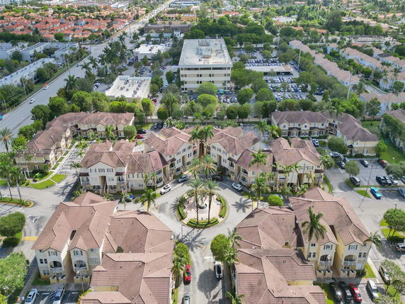 Panoramic aerial view of residential buildings and surrounding area.