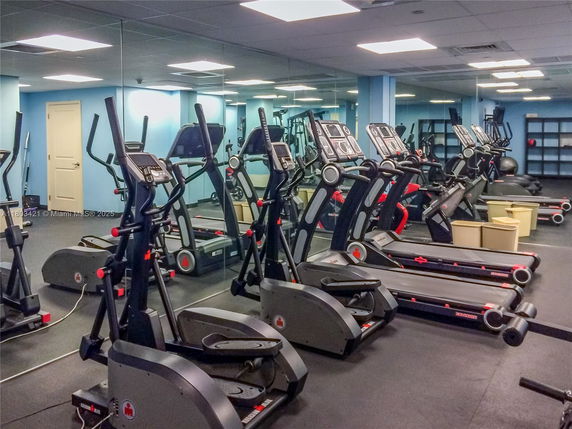 Indoor gym area with treadmills and exercise equipment.