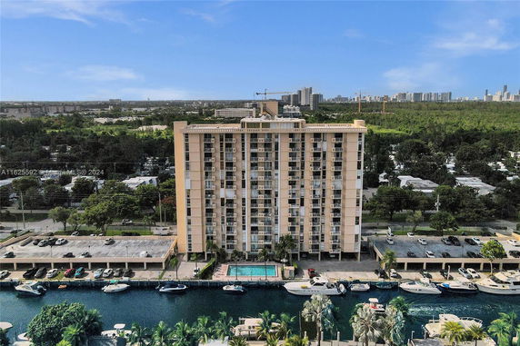 Front view of a multi-story residential building with balconies.