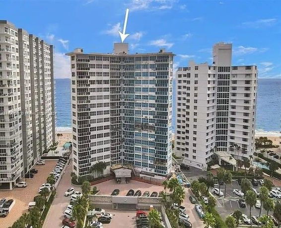 Front view of a high-rise building near the beach.