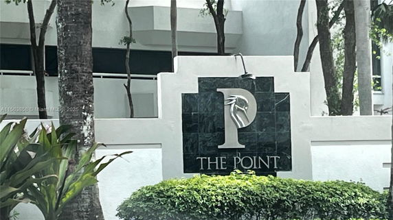 Front view of a building with a decorative sign reading 'The Point.'