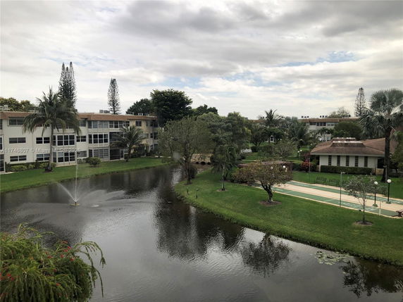 View of surrounding residential complex with pond and fountain