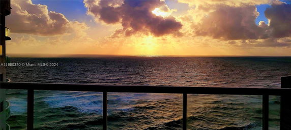 Panoramic view of the ocean during sunset from a building.