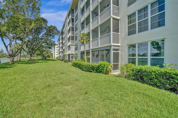 Front view of a multi-story residential building with balconies.