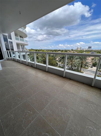 Balcony of a building overlooking the surrounding area.