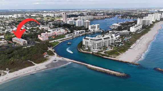 Aerial view of a coastal area with multiple high-rise buildings and waterways.