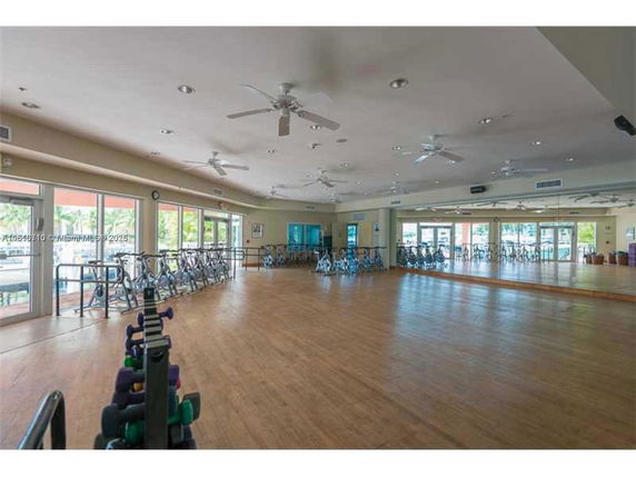 Indoor recreation area with exercise bikes and mirrors.